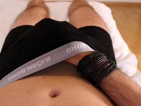 Boy plays with hard cock in boxers